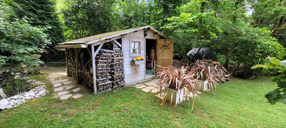 abri bois avec bucher 25 ans